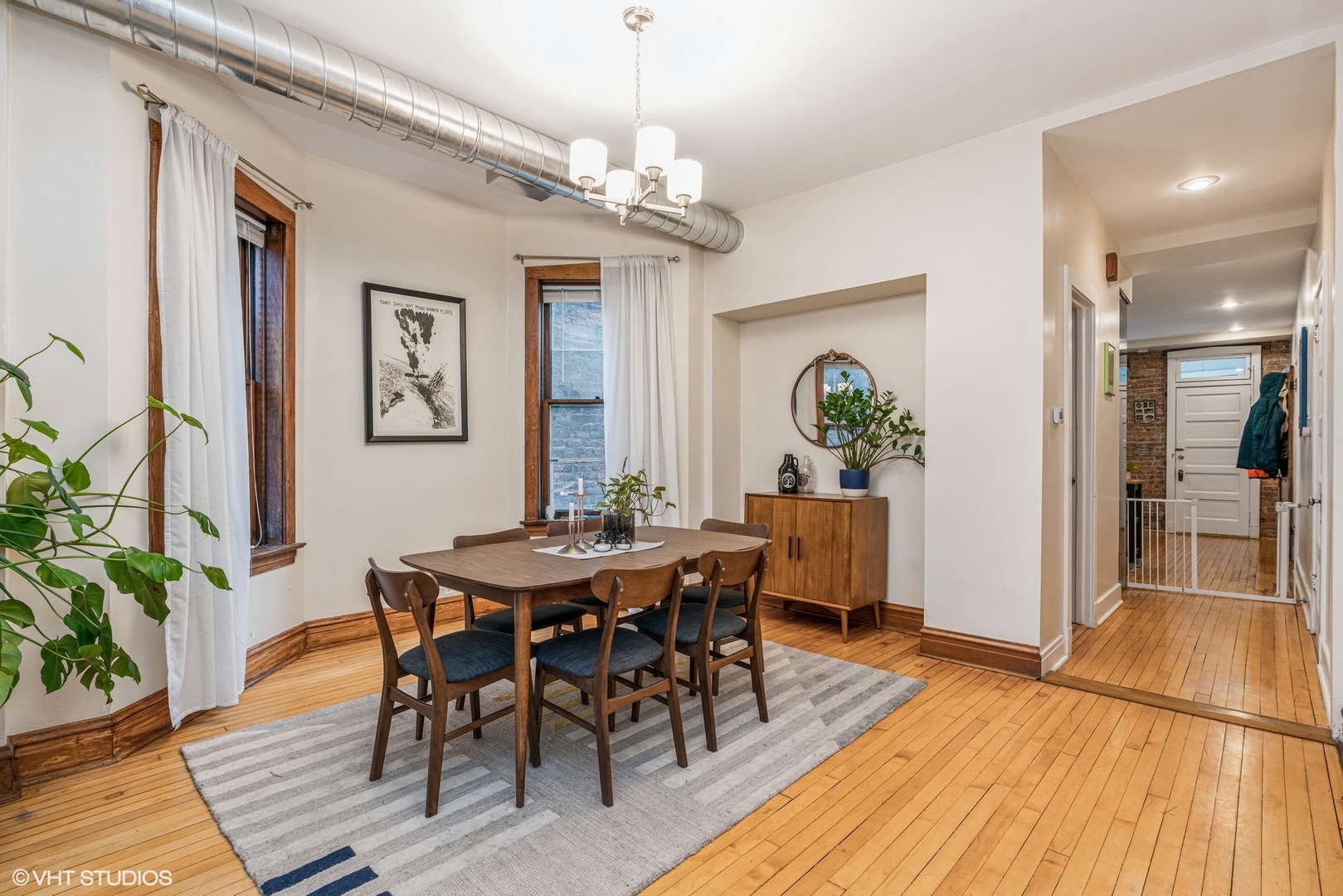 Undisclosed Address Chicago, IL 60622 - Photo 6 of 11 a view of a dining room with furniture and wooden floor