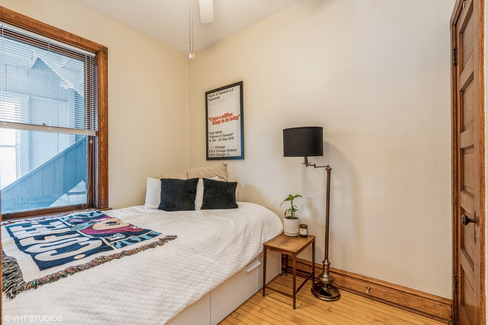 Undisclosed Address Chicago, IL 60622 - Photo 10 of 11 a bedroom with a bed and a flat screen tv