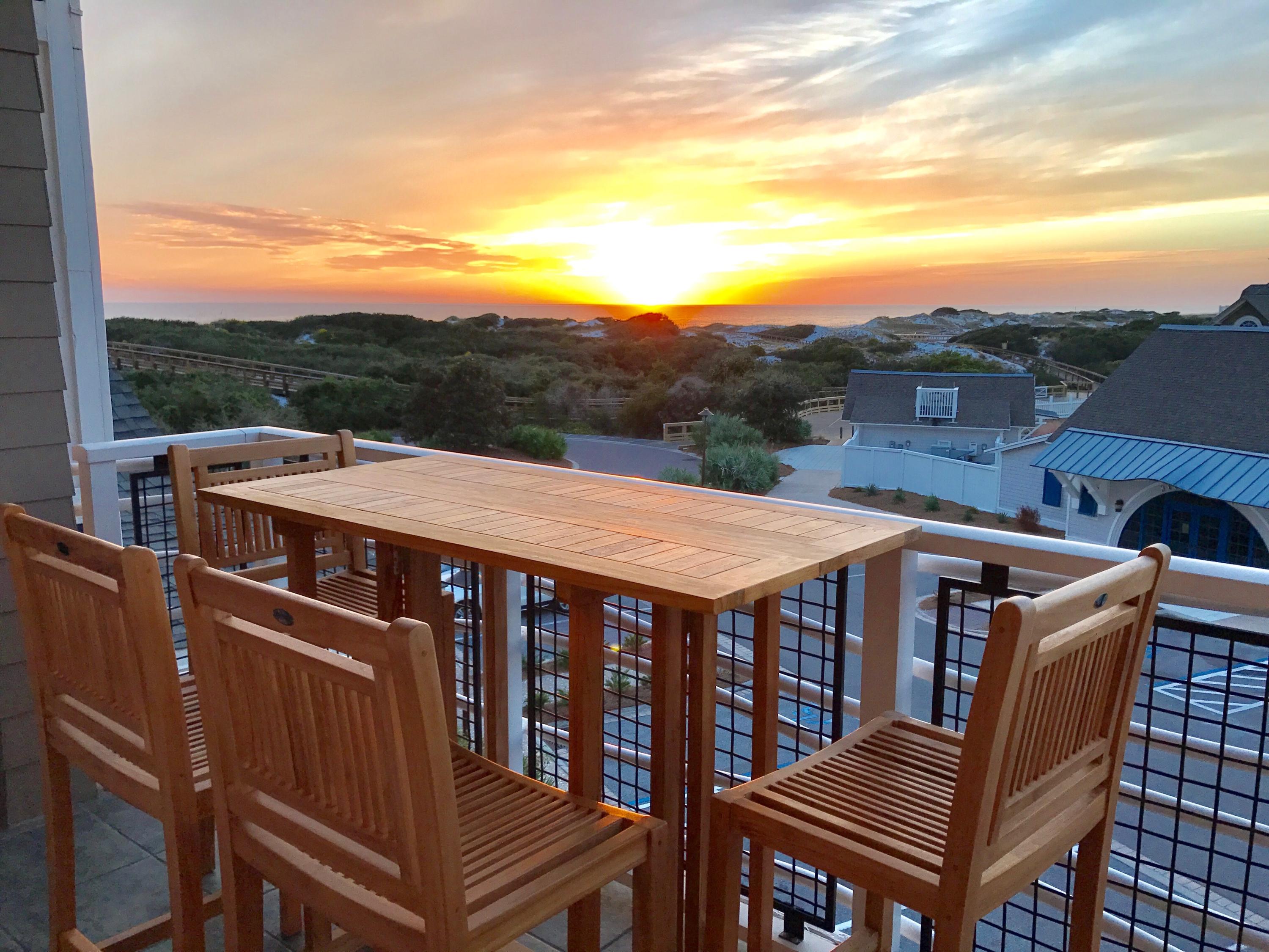 99 Compass Point Way South, Unit 304 Inlet Beach, FL 32461 - Photo 1 of 32 a view of a balcony with table and chairs