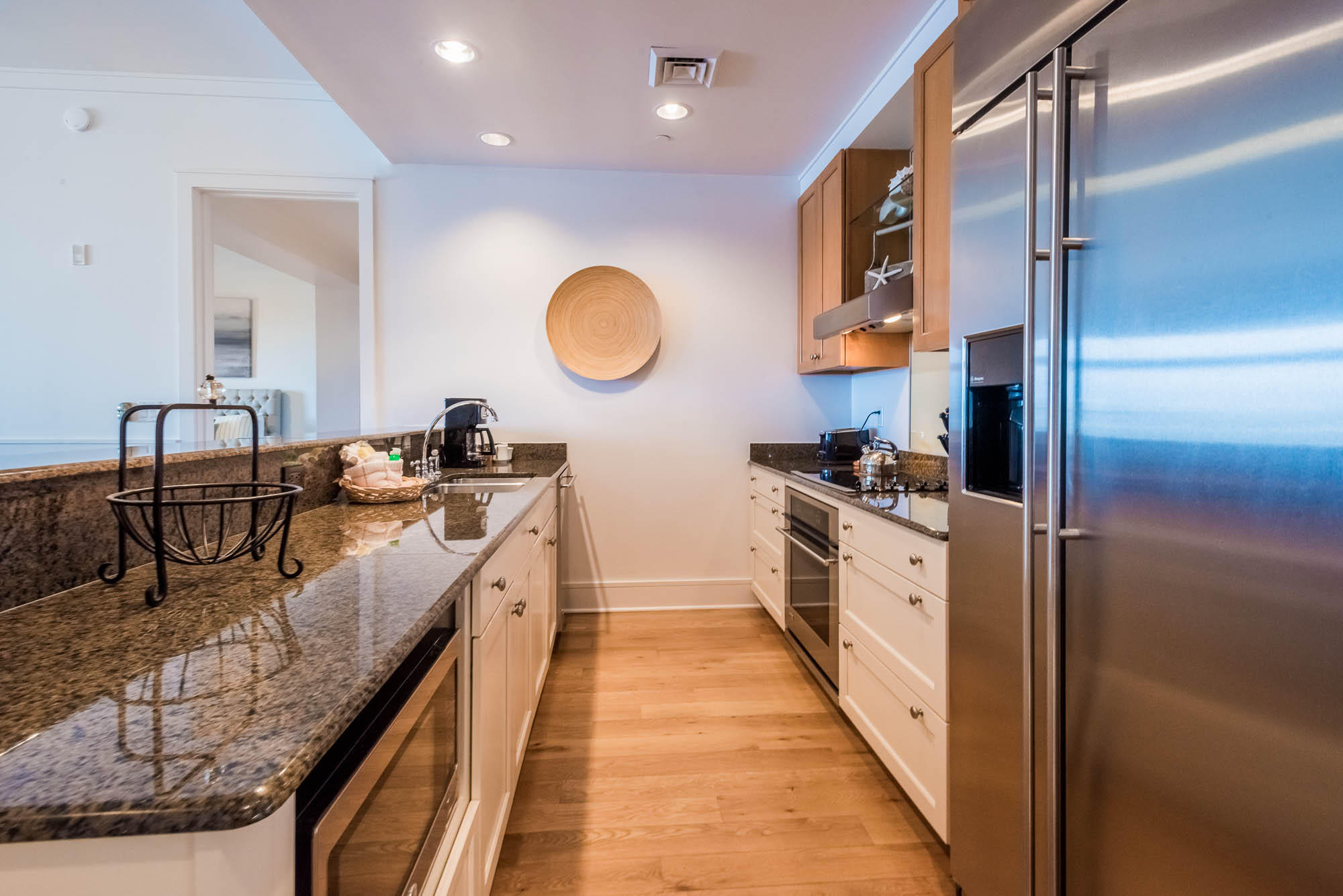 99 Compass Point Way South, Unit 304 Inlet Beach, FL 32461 - Photo 15 of 32 a large kitchen with stainless steel appliances granite countertop a lot of counter space and a sink