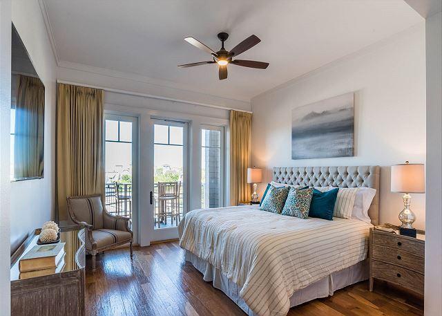 99 Compass Point Way South, Unit 304 Inlet Beach, FL 32461 - Photo 16 of 32 a bedroom with a bed and wooden floor