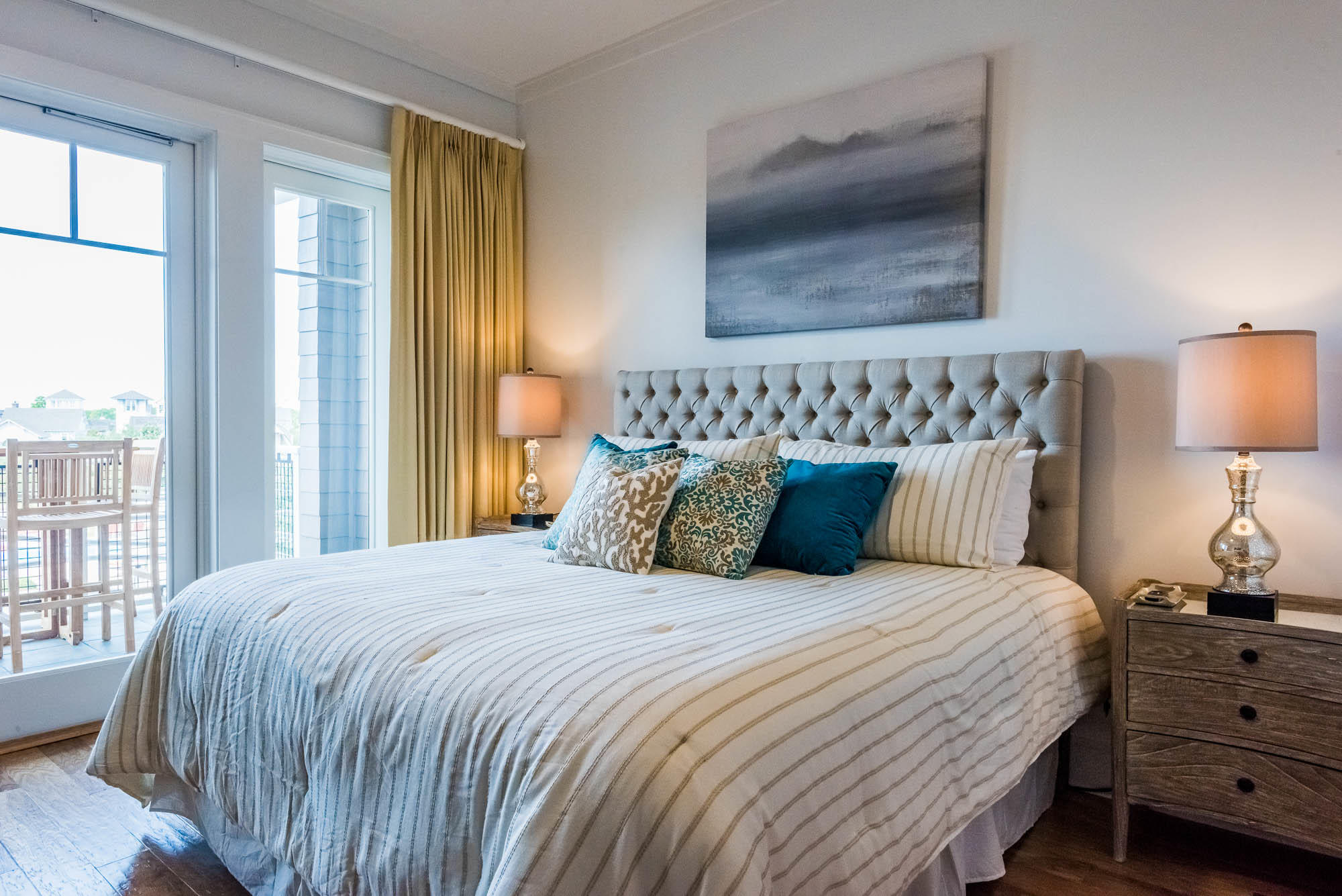 99 Compass Point Way South, Unit 304 Inlet Beach, FL 32461 - Photo 17 of 32 a bedroom with a bed and wooden floor