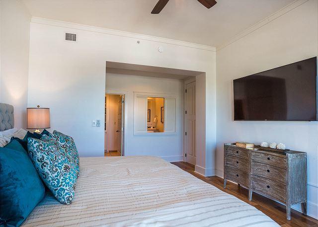 99 Compass Point Way South, Unit 304 Inlet Beach, FL 32461 - Photo 19 of 32 a bedroom with a bed and flat screen tv