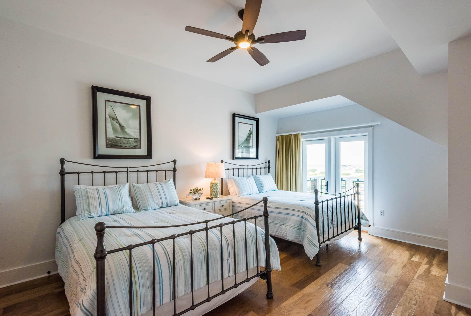 99 Compass Point Way South, Unit 304 Inlet Beach, FL 32461 - Photo 25 of 32 a bedroom with a beds chandelier and a window