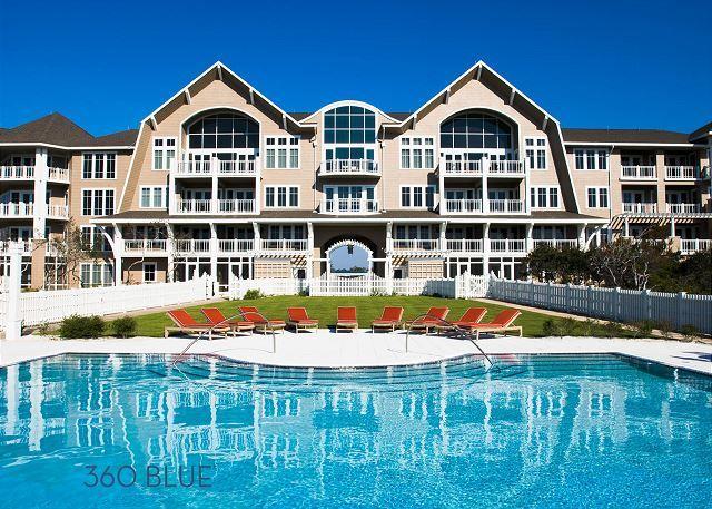 99 Compass Point Way South, Unit 304 Inlet Beach, FL 32461 - Photo 29 of 32 a view of an house with swimming pool and chairs