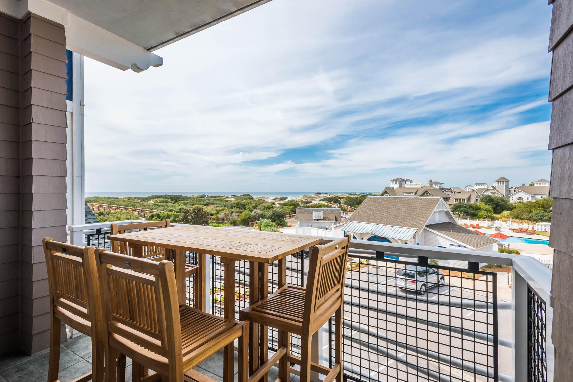 99 Compass Point Way South, Unit 304 Inlet Beach, FL 32461 - Photo 4 of 32 a view of a balcony with an outdoor seating