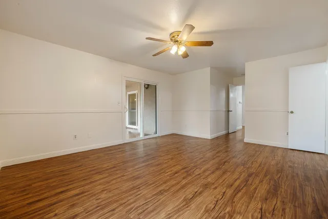a bathroom with a tub a double vanity sink and a mirror