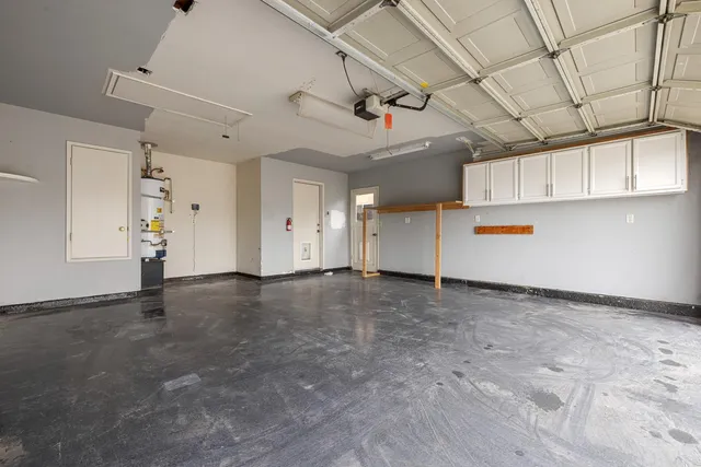 a view of a house with backyard and a garden