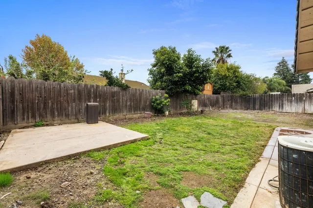an aerial view of a house with garden space and street view