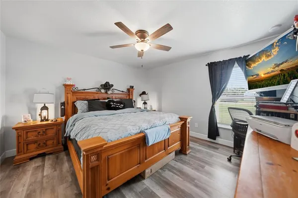 a bed room with a bed and a tv