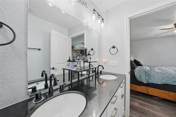 a dining room with furniture and wooden floor