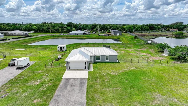a view of a lake with a yard