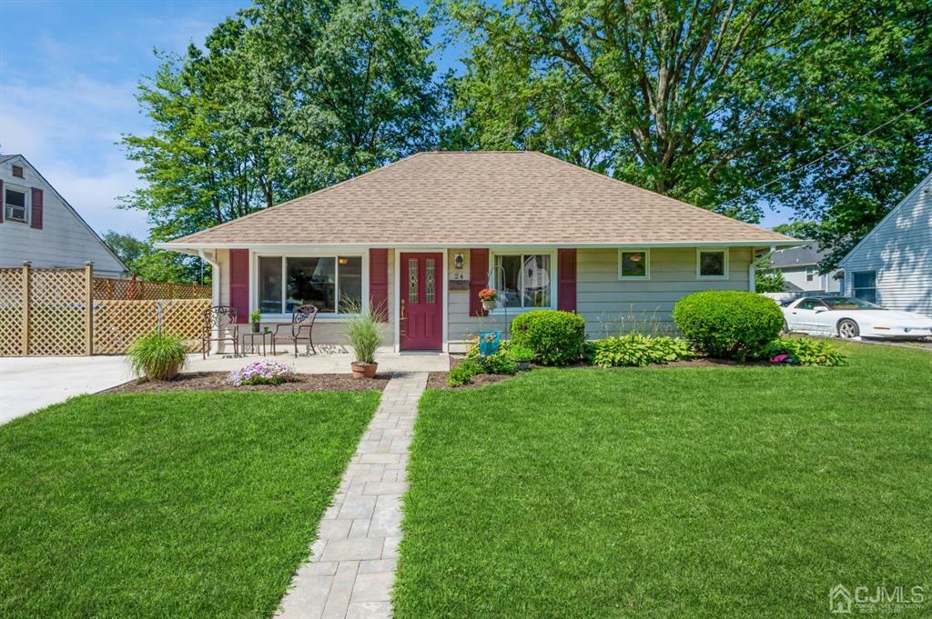 24 Markham Road Edison, NJ 08817 - Photo 1 of 20 a front view of a house with garden