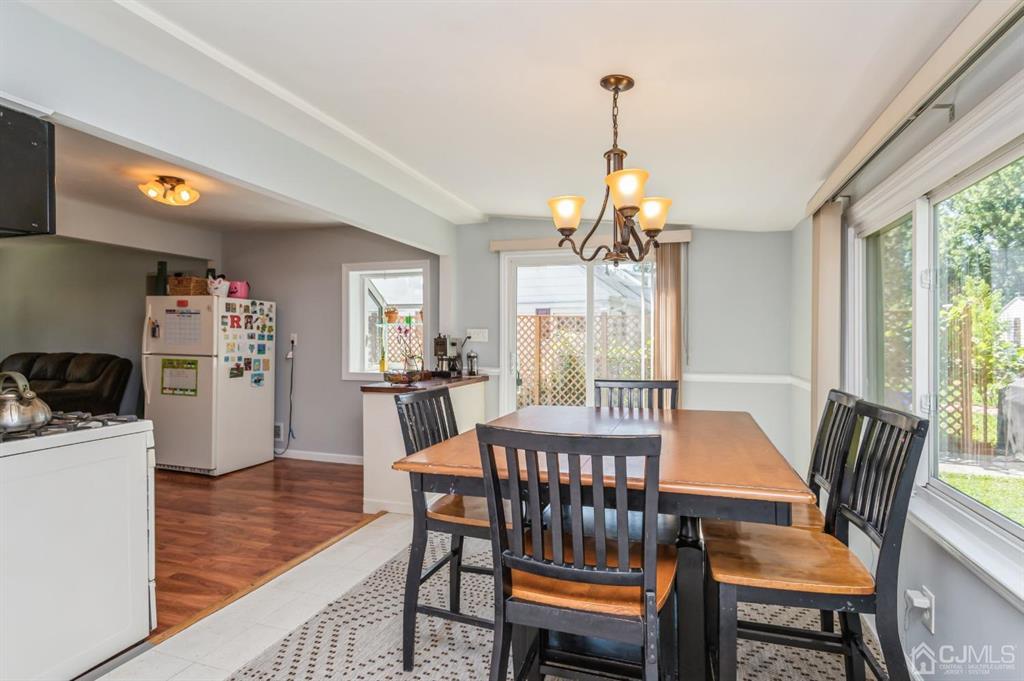 24 Markham Road Edison, NJ 08817 - Photo 9 of 20 a view of a dining room with furniture window and wooden floor