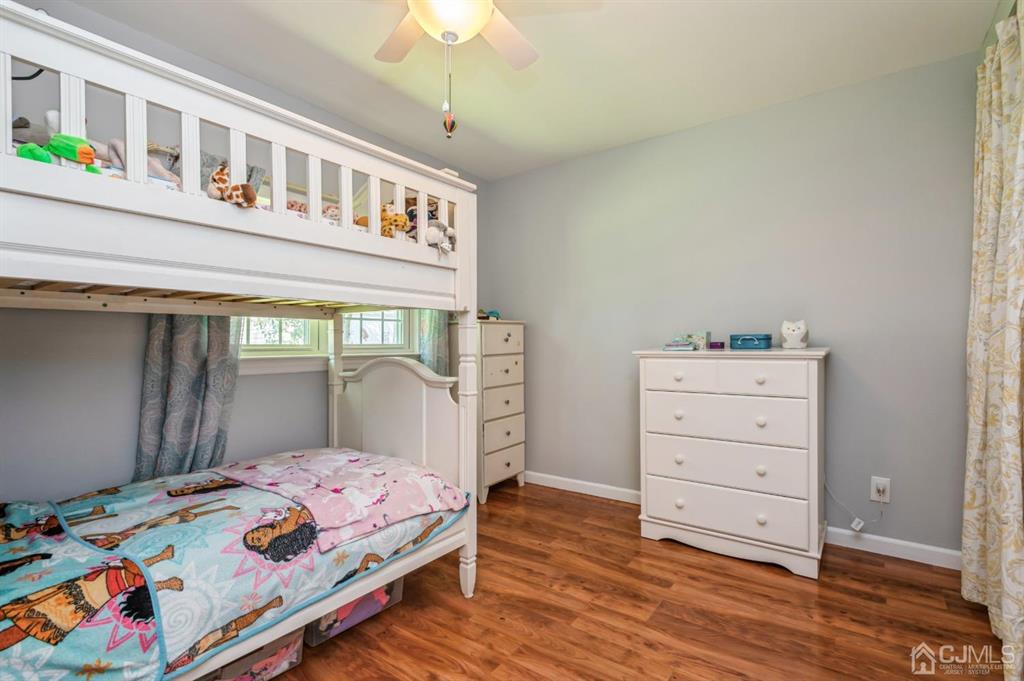 24 Markham Road Edison, NJ 08817 - Photo 11 of 20 a bedroom with a bed and a dresser