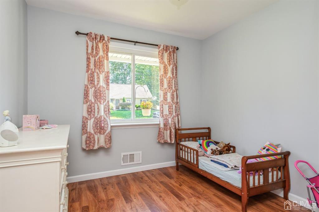 24 Markham Road Edison, NJ 08817 - Photo 12 of 20 a bedroom with furniture and a window