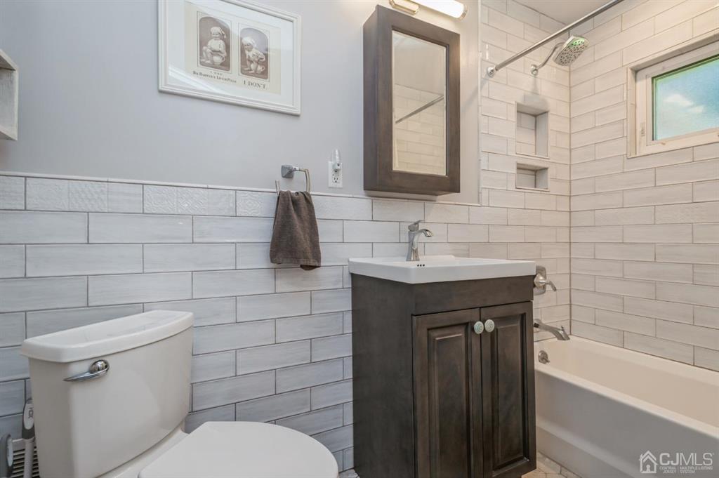 24 Markham Road Edison, NJ 08817 - Photo 13 of 20 a bathroom with a sink a toilet and shower