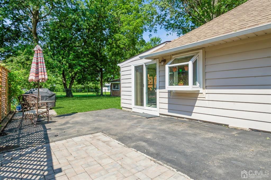 24 Markham Road Edison, NJ 08817 - Photo 14 of 20 a view of a house with backyard and a garden