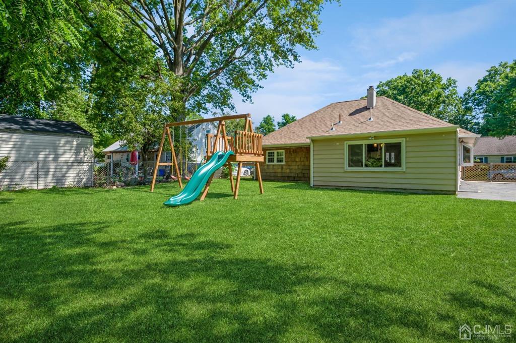 24 Markham Road Edison, NJ 08817 - Photo 15 of 20 a view of a house with a backyard