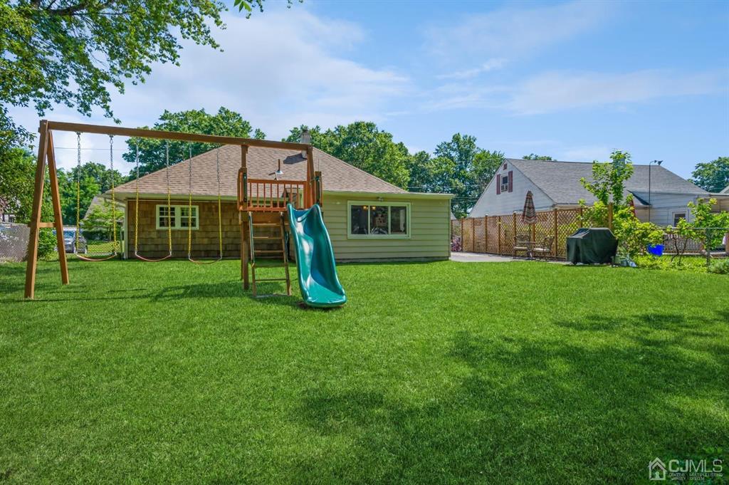 24 Markham Road Edison, NJ 08817 - Photo 16 of 20 a view of a house with a backyard