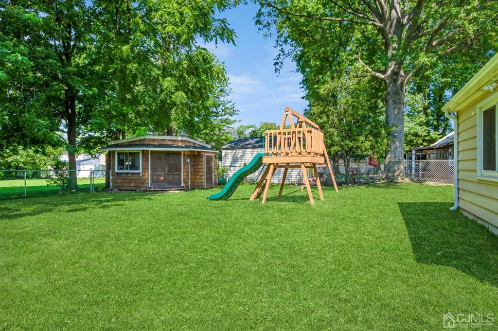 24 Markham Road Edison, NJ 08817 - Photo 17 of 20 a view of a house with a backyard