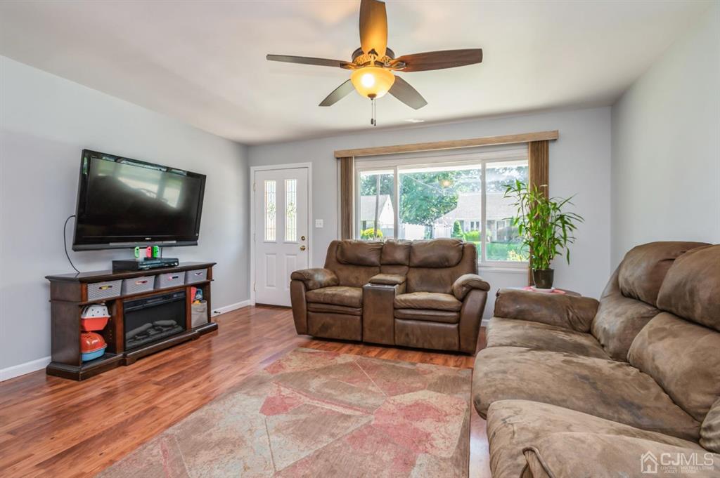 24 Markham Road Edison, NJ 08817 - Photo 2 of 20 a living room with furniture and a flat screen tv