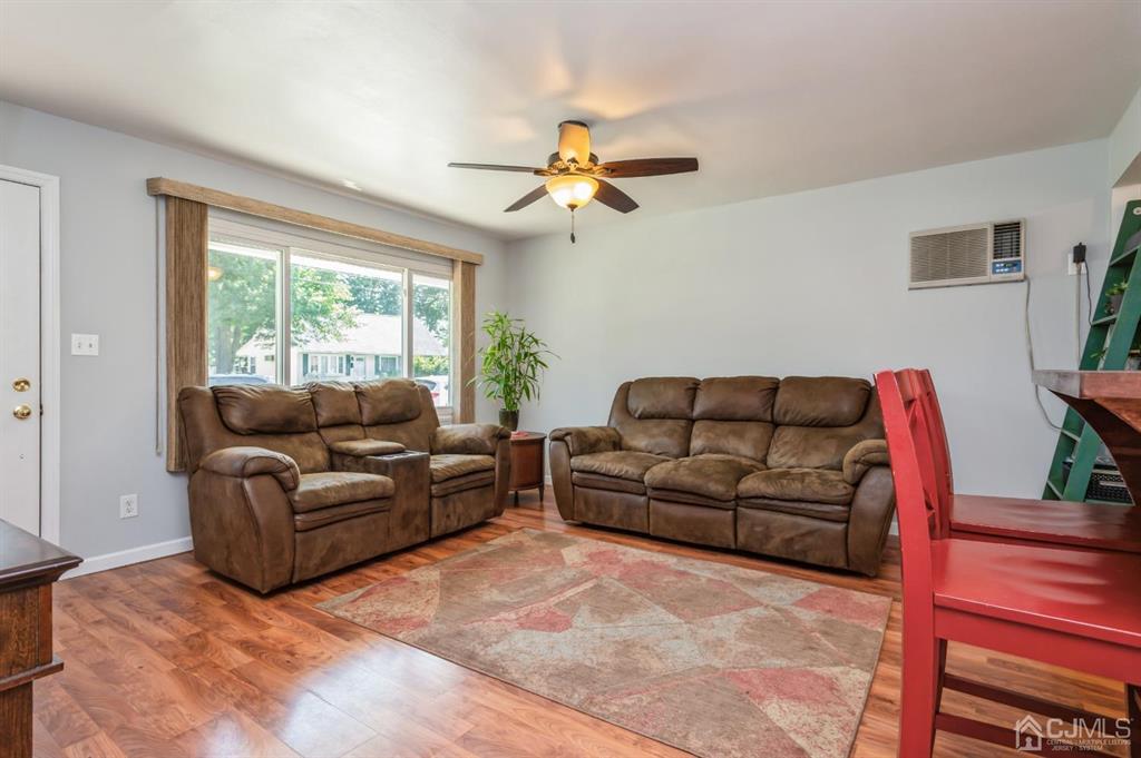 24 Markham Road Edison, NJ 08817 - Photo 3 of 20 a living room with furniture ceiling fan and a window