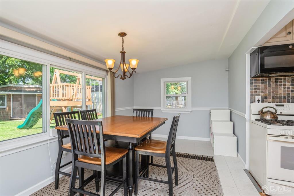24 Markham Road Edison, NJ 08817 - Photo 7 of 20 a view of a dining room with furniture window and outside view