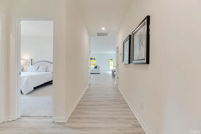 a view of a bedroom from a hallway