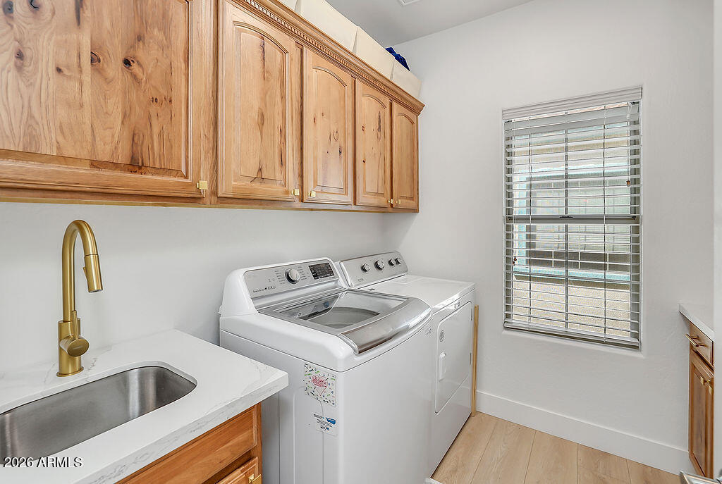 3116 East Tamarisk Street Gilbert, AZ 85296 - Photo 18 of 35 a kitchen with a sink cabinets and a window