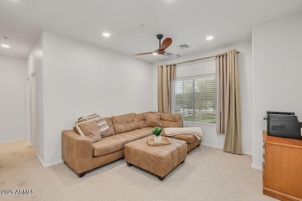 3116 East Tamarisk Street Gilbert, AZ 85296 - Photo 24 of 35 a living room with furniture and a large window
