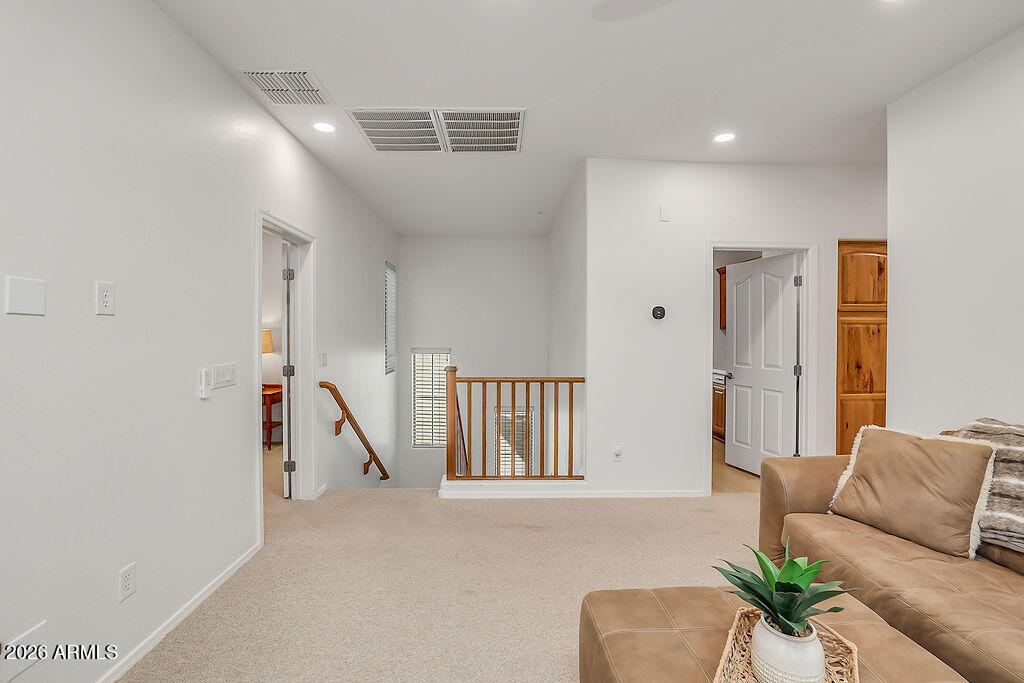 3116 East Tamarisk Street Gilbert, AZ 85296 - Photo 25 of 35 a living room with furniture and a large window