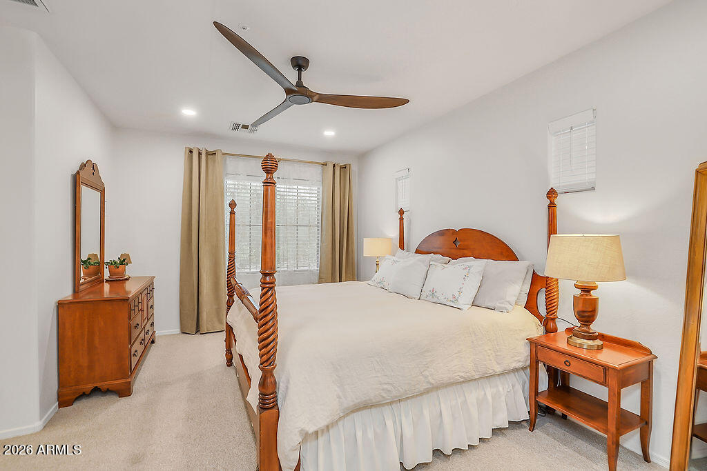 3116 East Tamarisk Street Gilbert, AZ 85296 - Photo 30 of 35 a bedroom with a bed and a large mirror