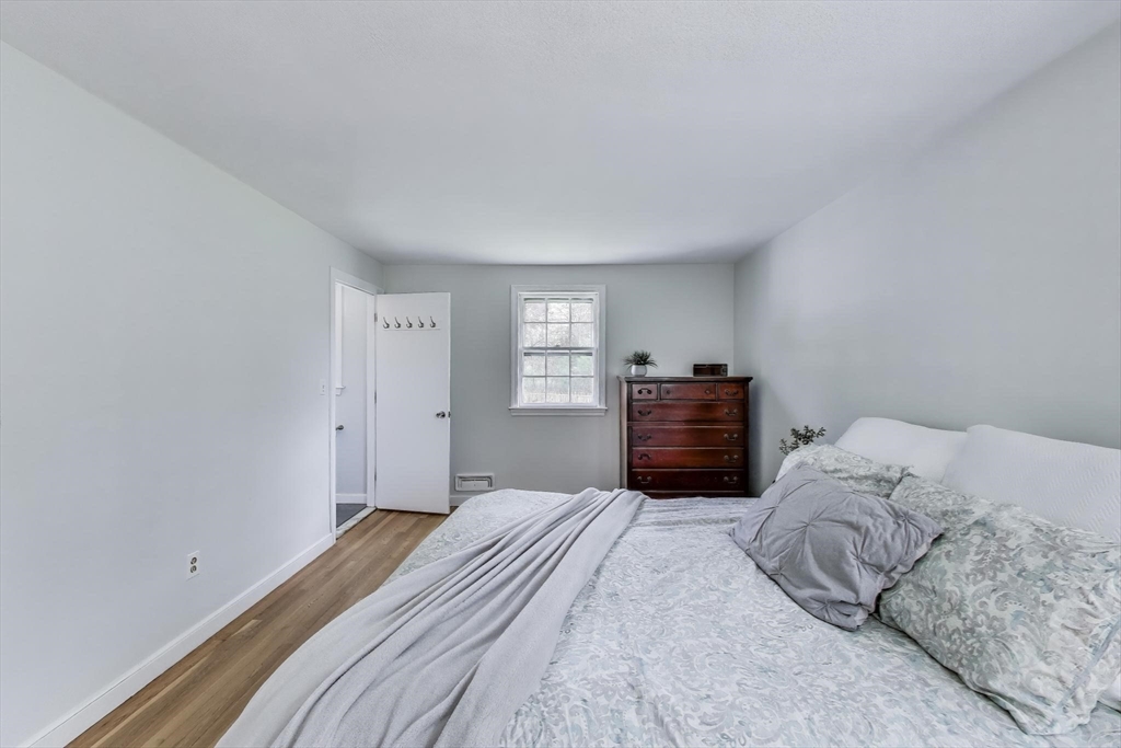 24 Spruce Drive Westwood, MA 02090 - Photo 14 of 32 a bedroom with a bed and a closet