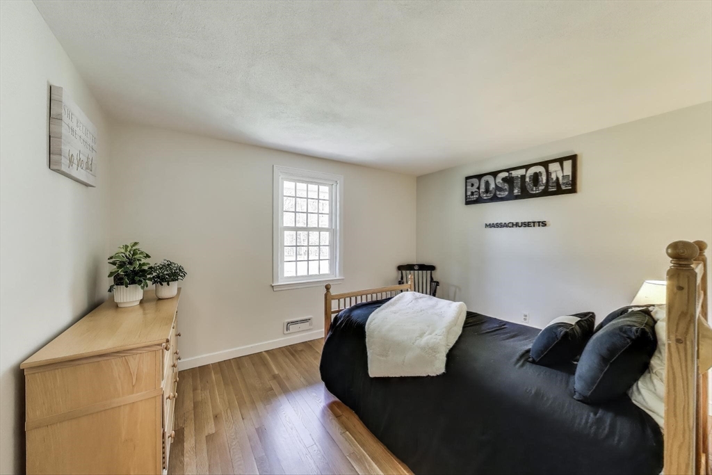 24 Spruce Drive Westwood, MA 02090 - Photo 18 of 32 a bedroom with furniture and a window