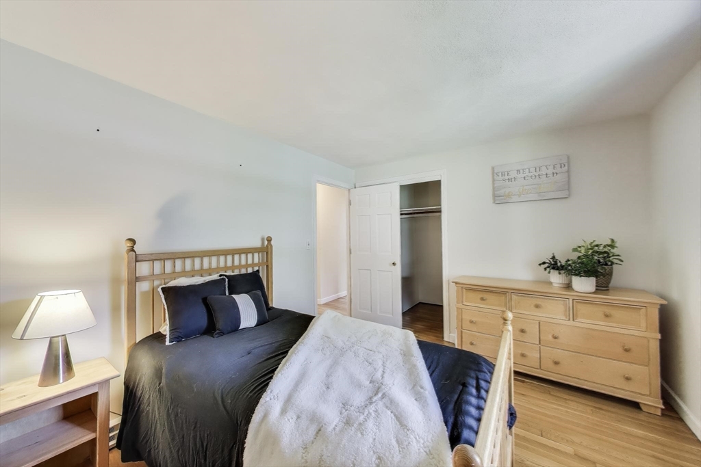 24 Spruce Drive Westwood, MA 02090 - Photo 19 of 32 a bedroom with a bed and a closet