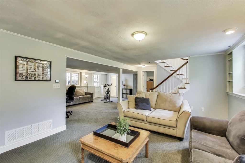 24 Spruce Drive Westwood, MA 02090 - Photo 22 of 32 a living room with furniture and a table