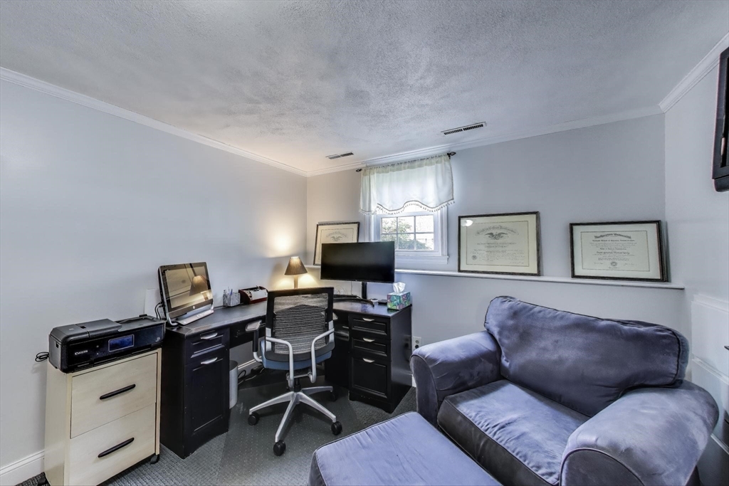 24 Spruce Drive Westwood, MA 02090 - Photo 23 of 32 a view of a livingroom with workspace and a couch