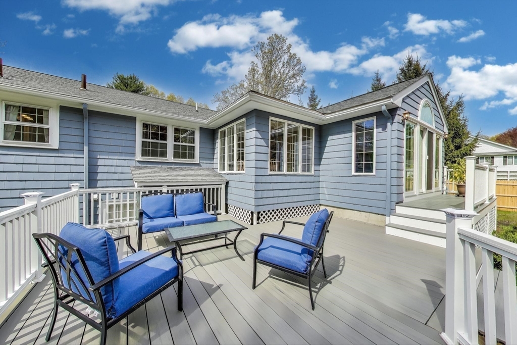 24 Spruce Drive Westwood, MA 02090 - Photo 26 of 32 a roof deck with a couch and chairs