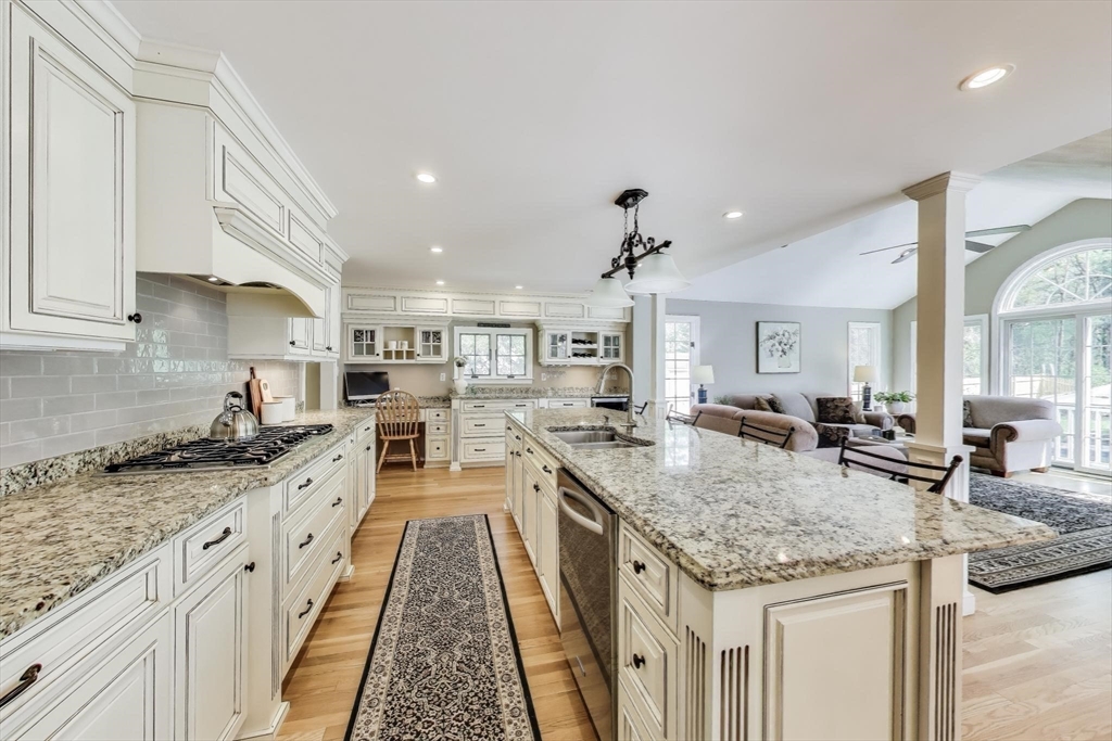 24 Spruce Drive Westwood, MA 02090 - Photo 6 of 32 a open kitchen with granite countertop a sink and stove