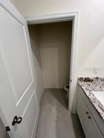 a view of storage and utility room with cabinet