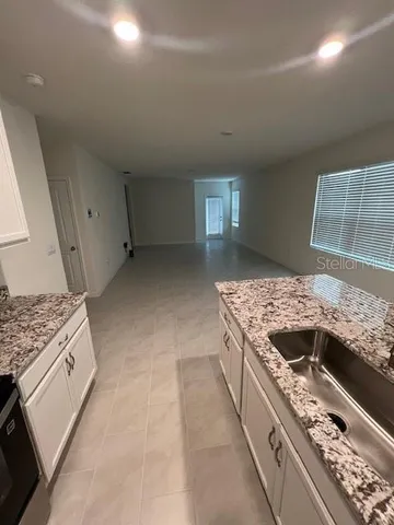 a kitchen with a stove and a sink