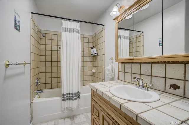 a living room with furniture and a gate