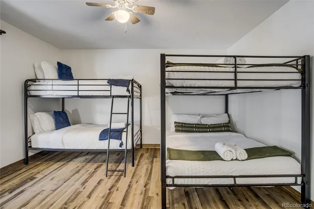 a bathroom with a sink a mirror a bathtub and a shower