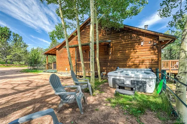 a view of a lush green hillside and a houses