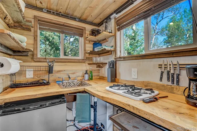 a bedroom with a bed and a flat tv screen