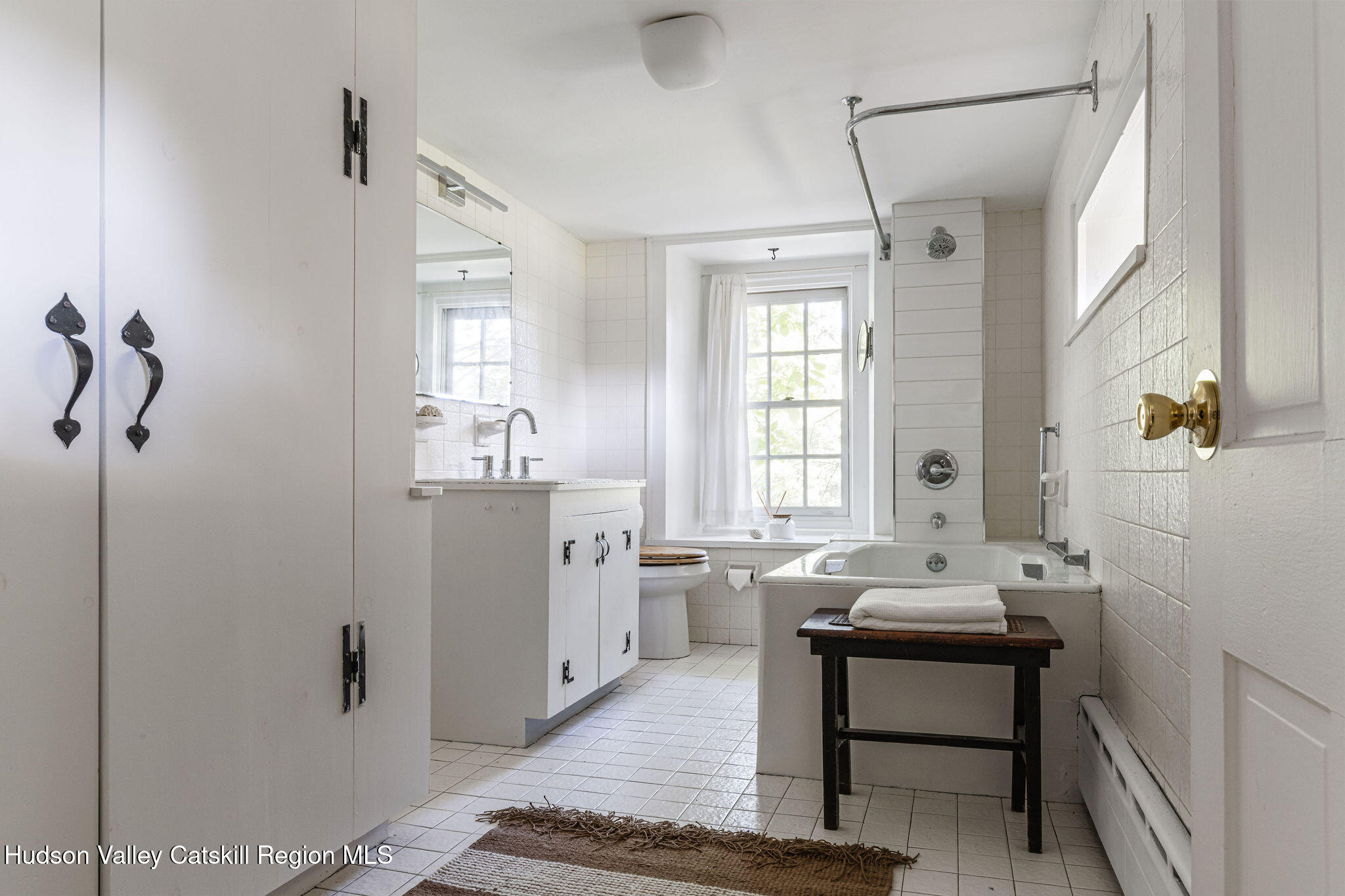 90 Upper Whitfield Road Accord, NY 12404 - Photo 11 of 12 a bathroom with a sink a mirror and a bathtub