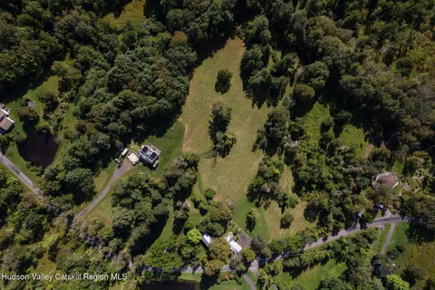 a view of a house with a tree