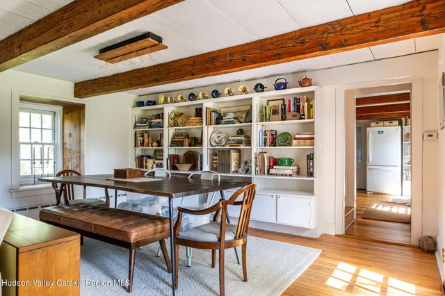 a view of a chairs and table in a living room
