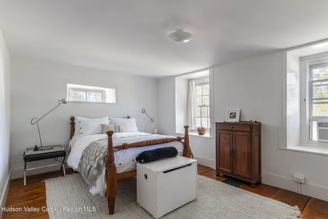 a bed room with a bed and a window